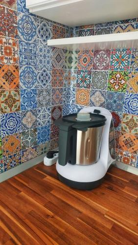 a toilet in a room with tiles on the wall at Mar&Mat in Giarre