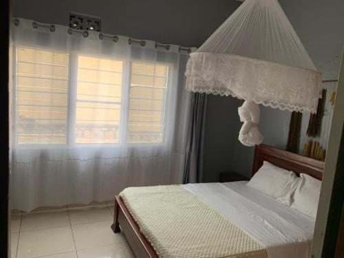 Llit o llits en una habitació de Inkindi House