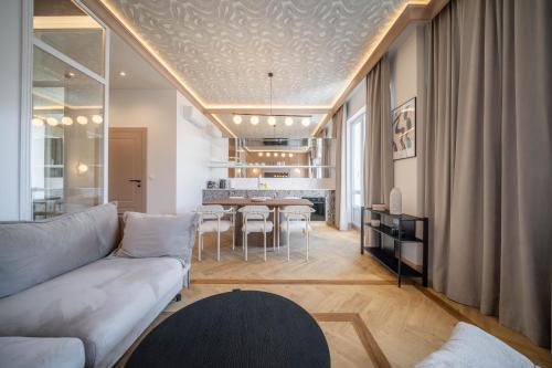 a living room with a couch and a table at Marszałkowska Luxury Apartments by Sofija in Warsaw