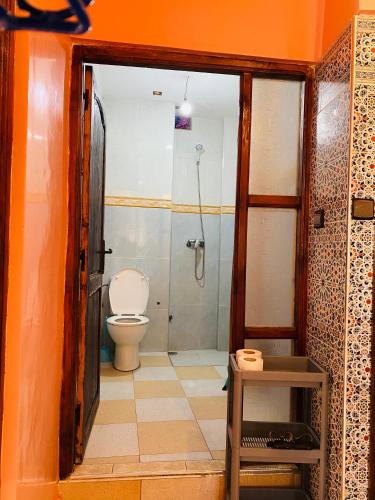 a bathroom with a shower and a toilet in it at Vitamin taliouine appartement in Taghazout