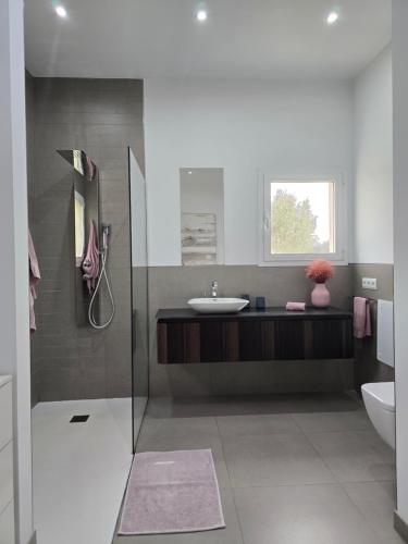 a bathroom with a sink and a toilet at Casa Blanca in Sencelles