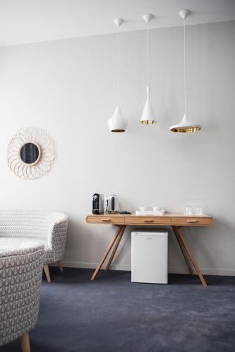 a dining room with a table and a chair at Hôtel de Tourny - Boutique Hôtel Bordeaux Centre in Bordeaux