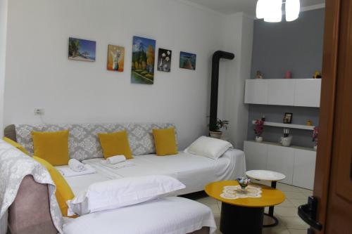 a living room with a couch and a table at Diar Sea House in Orikum