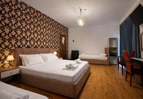 Llit o llits en una habitació de Hotel Globo
