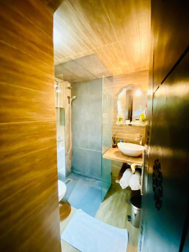 a bathroom with two sinks and a mirror at New dream home in Fez