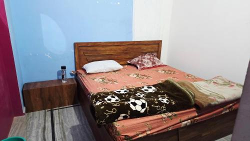 a bed in a room with at Radha Rani Guest House in Sīkar