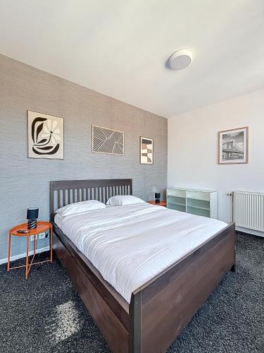 a bedroom with a large bed in a room at Keyless Hotel - Van Gaver in Brussels