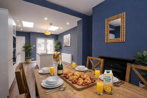 a dining room with a table with a plate of food at Falklands street City centre House-Free Parking in York
