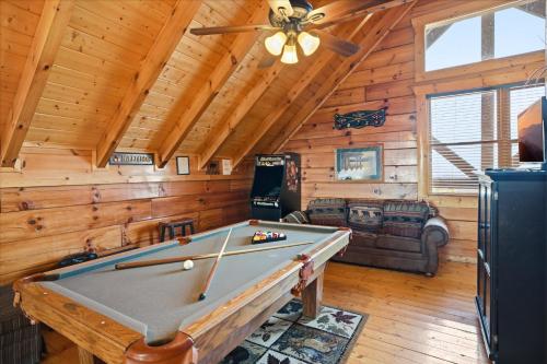 a pool table in a room with a ceiling at Smoky Mountain Bliss by Beyond Expectations in Sevierville