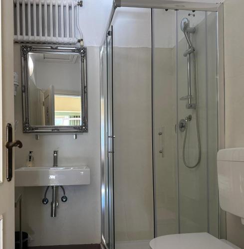 a bathroom with a shower and a sink at Boboli Living in Florence