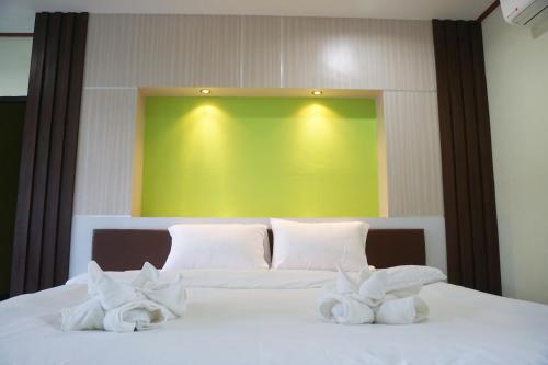 Honey Hotel Chiang Saenにあるベッド