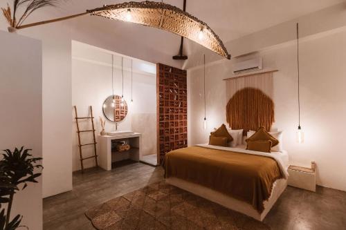 a bedroom with a bed in a room at Casa Leone Villa Canggu by Summerhouse Bali in Canggu