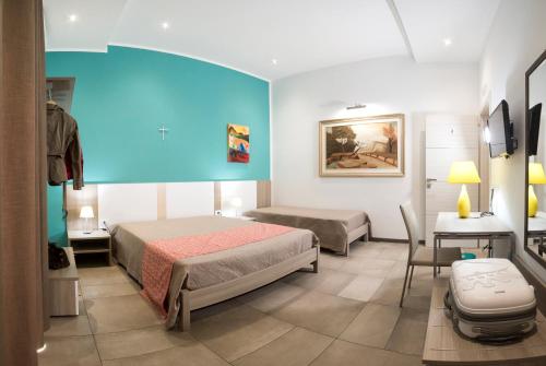 En eller flere senge i et værelse på La Rocca Scavata