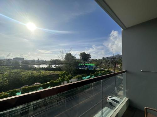 a balcony with a view of a river at Boat Avenue Apartment in Bang Tao Beach