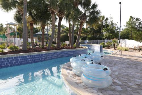 a swimming pool with a row of inflatables lined up at Unit at the Sheraton Broadway Plantation in Myrtle Beach