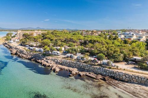 an aerial view of a beach with houses and the water at Secret View Glamp - La Mariposa in Alghero