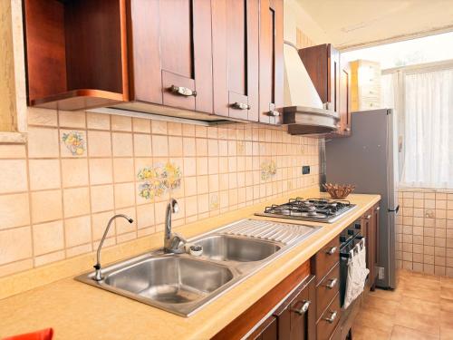 a kitchen with a sink and a stove at Art & Relax House in Gallipoli