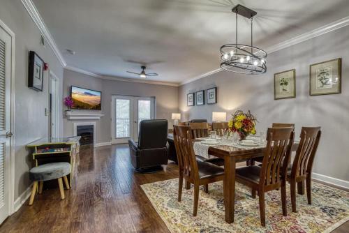 a dining room with a table and chairs at Mountain View Condo by Beyond Expectations in Pigeon Forge