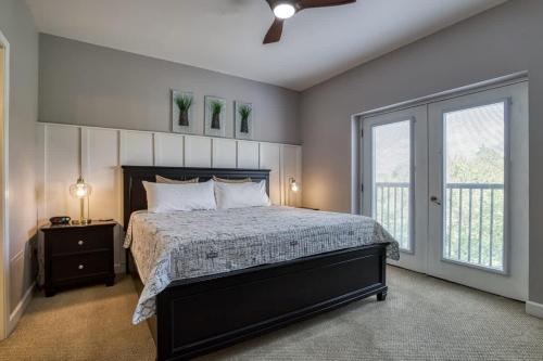 a bedroom with a large bed and a window at Mountain View Condo by Beyond Expectations in Pigeon Forge