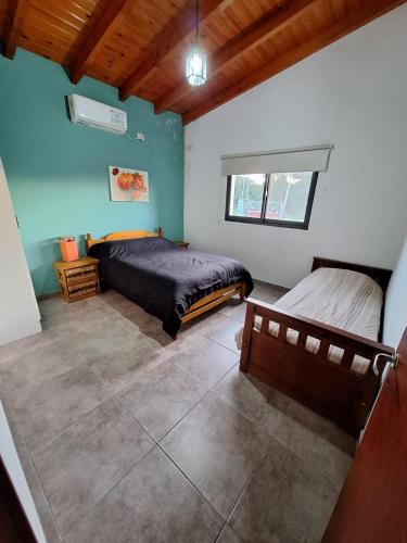 a bedroom with two beds in a room at Quinta El Oasis ORO VERDE in Oro Verde