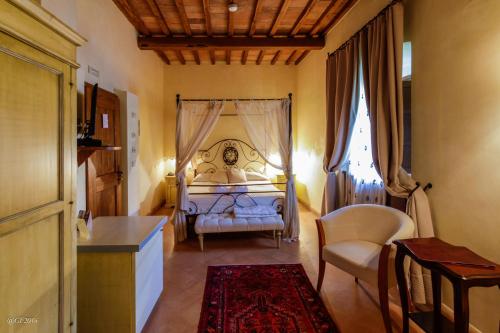Postel nebo postele na pokoji v ubytování San Pietro Sopra Le Acque Resort & Spa