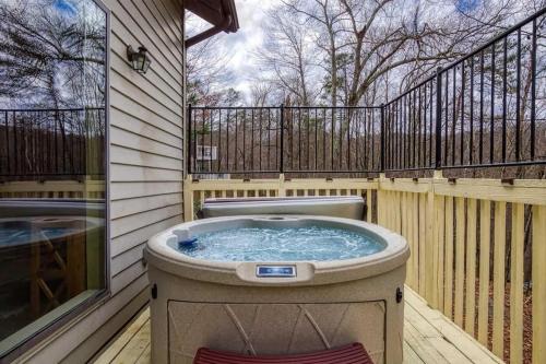 a hot tub on the back of a house at Bearly Makin It II by Beyond Expectations in Gatlinburg