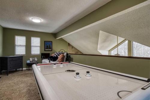 a living room with a large pool table in it at Bearly Makin It II by Beyond Expectations in Gatlinburg