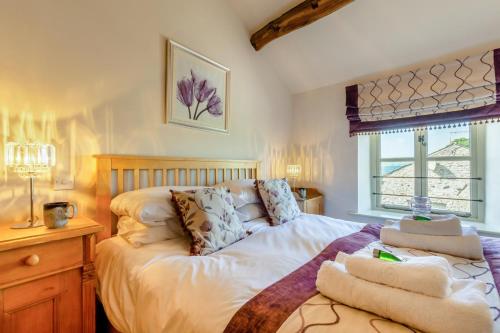 a bedroom with a bed with towels on it at 2 Bed in Middleton oc-m29515 in Middleton
