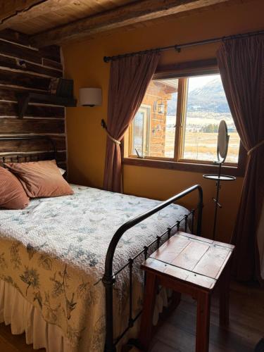 a bedroom with a bed and a window at Yellowstone House in Livingston