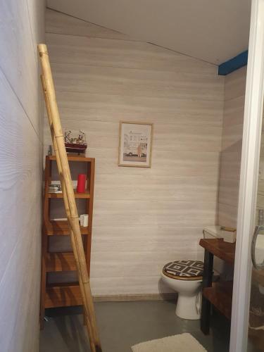 a bathroom with a staircase leading to a toilet at Studio proche de l'Océan - Calme et Pratique in Capbreton