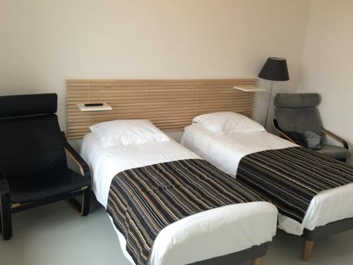 Una cama o camas en una habitación de Residence Service Appart Hôtel
