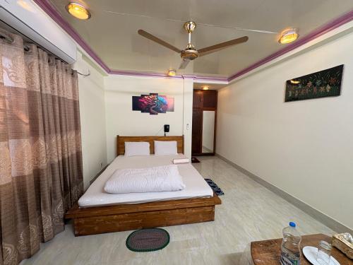 Vuode tai vuoteita majoituspaikassa Green Zone Cottage