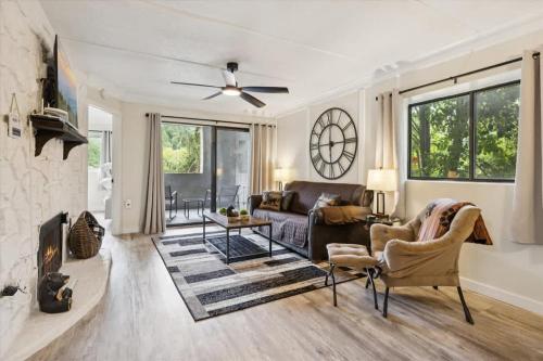 a living room with a couch and a ceiling fan at Baskins Creek II by Beyond Expectations w Balcony in Gatlinburg
