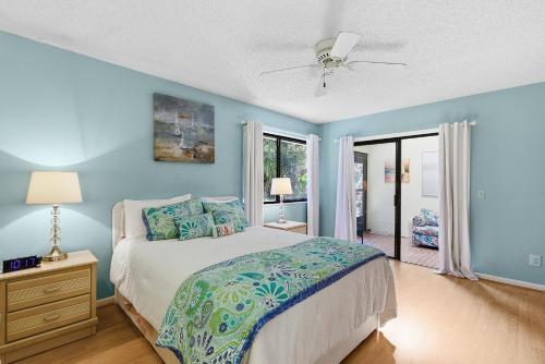 a bedroom with a bed and a ceiling fan at Sea Woods Villa 4263 in New Smyrna Beach