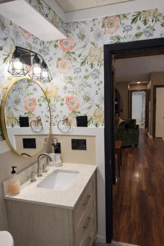a bathroom with a sink and a mirror at Massanutten Chalet View & Fire Table Deck in McGaheysville