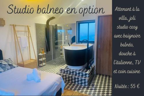 a bathroom with a bath tub in a room at Maison avec piscine et vue panoramique in Albi