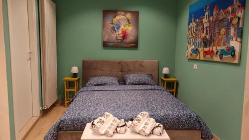 a bedroom with a bed with shoes on it at Il Loft di Pieve in Città della Pieve