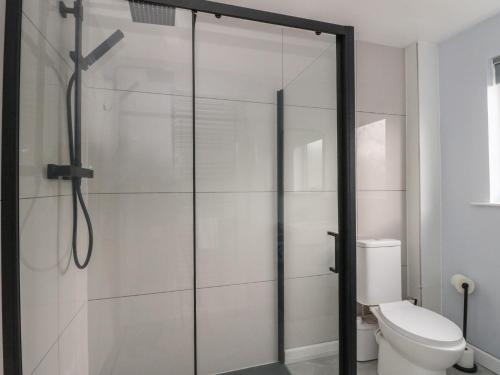 a bathroom with a shower with a toilet at Pirnies in Pitlochry