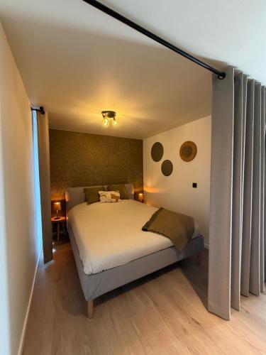 a bedroom with a bed in a room at Lavand'in Durbuy in Durbuy