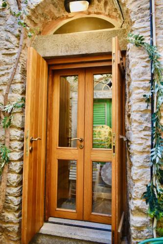 an entrance to a stone building with a wooden door at Mesta Loft in Mestá