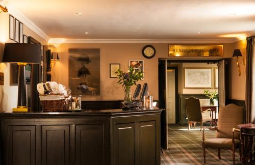 a kitchen with a counter and a dining room at Leonardo Boutique Huntingtower Perth in Perth