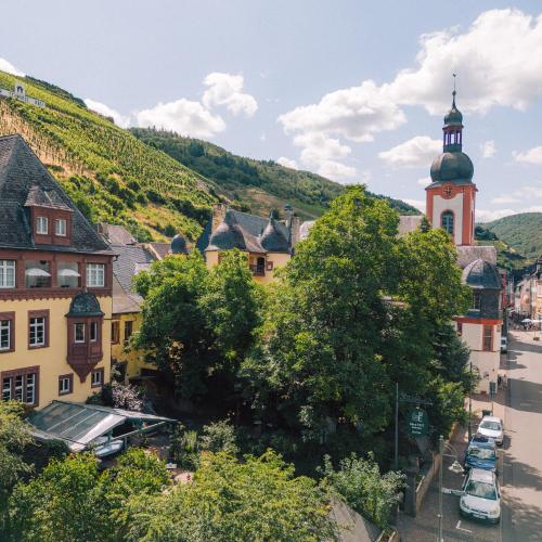 a town with a clock tower and a street at Haus Till E in Zell an der Mosel
