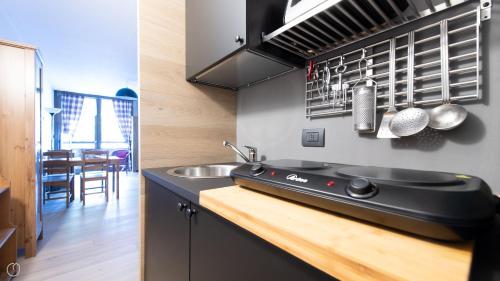 a kitchen with a sink and a counter top at Plagheira 1 in Santa Caterina Valfurva