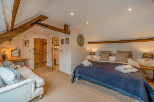 a bedroom with a large bed and a white couch at 3 Bed in Sedgehill oc-b34698 in Sedghill