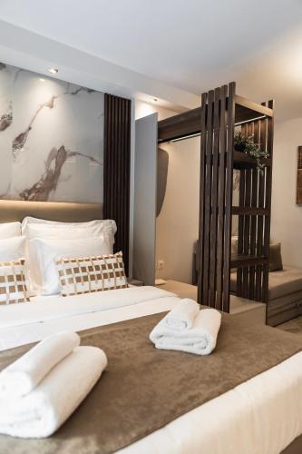 Lova arba lovos apgyvendinimo įstaigoje Oniro Suites Level 4