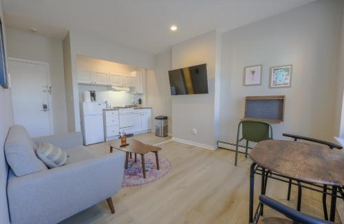 a living room with a couch and a table at Urban Chic South End Studio in Boston