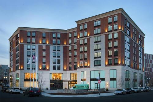 a large building with cars parked in a parking lot at Homewood Suites by Hilton Providence Downtown in Providence