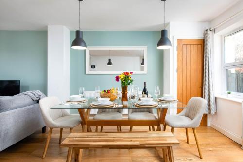 a dining room with a table and chairs at Large 5Bed Town House-Sleeps 9-By FabAccommodation in Bristol