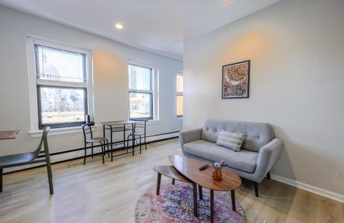 a living room with a couch and a table at Urban Chic South End Studio in Boston