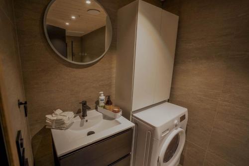 a bathroom with a sink and a mirror at Mountain View Apartment 201 in Stranda